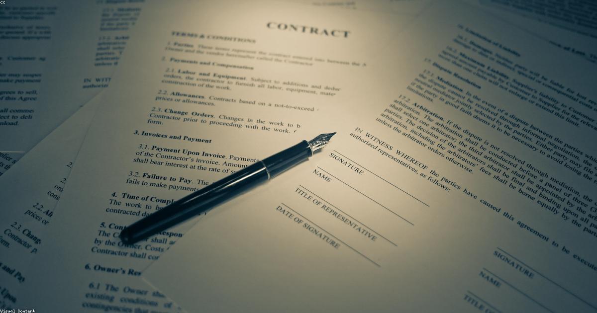 Person organising passport and work permit documents for a UAE visa application